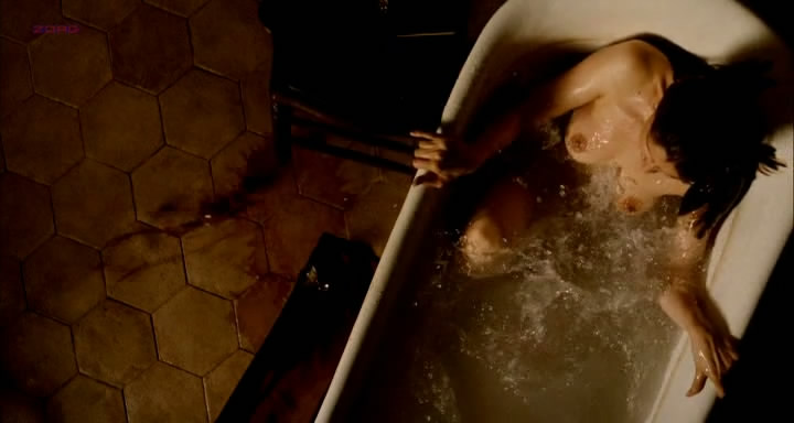 Laetitia Casta nude topless in the bath from - Derriere les murs (2011)