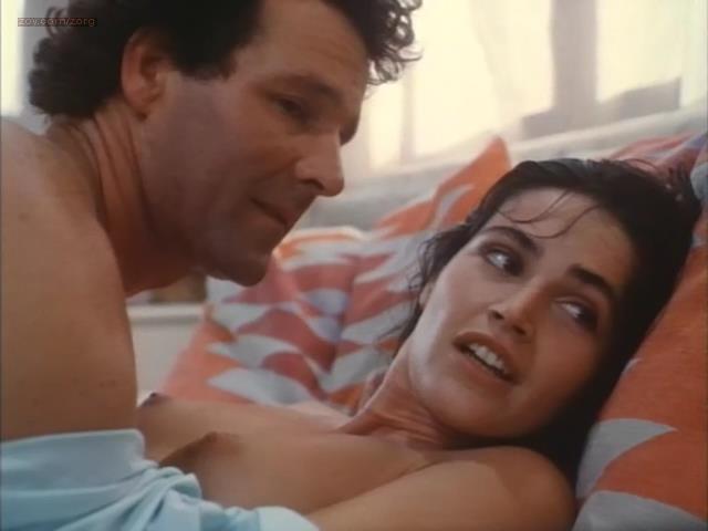 Kim Delaney nude topless in – The Drifter (1988)
