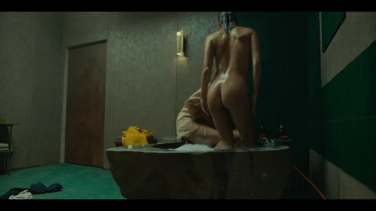 Alicia Vikander nude butt scenes and side boob, and Elizabeth Olsen wet see-through in The Assessment (2024) 1080p Web